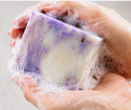 Lavender soap lathering in hands