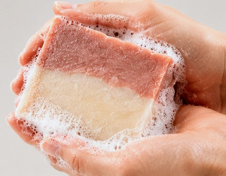 Cherry almond soap lathering in hands