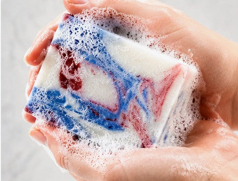 Clean Cut Clothesline soap lathering in hands - red white blue swirl